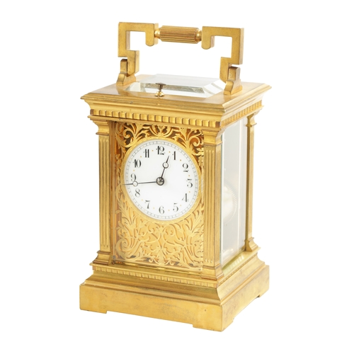 658 - A LATE 19TH CENTURY FRENCH BRASS CASED REPEATING CARRIAGE CLOCK with filigree masked dial, having an... 