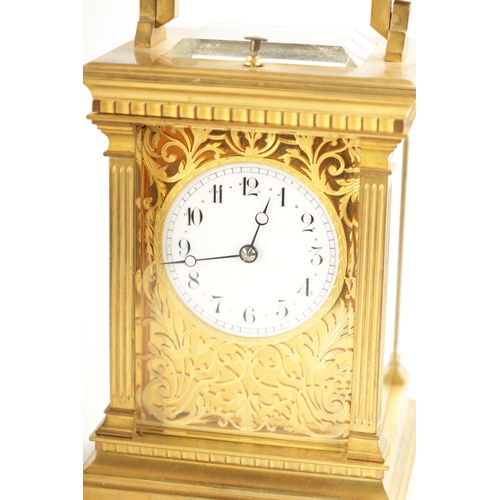 658 - A LATE 19TH CENTURY FRENCH BRASS CASED REPEATING CARRIAGE CLOCK with filigree masked dial, having an... 