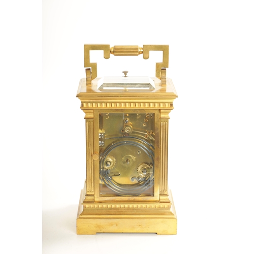 658 - A LATE 19TH CENTURY FRENCH BRASS CASED REPEATING CARRIAGE CLOCK with filigree masked dial, having an... 