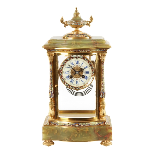 663 - A LATE 19TH CENTURY FRENCH ORMOLU, CHAMPLEVE ENAMEL AND ONYX MANTEL CLOCK surmounted by an urn finia... 