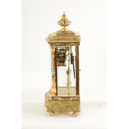 663 - A LATE 19TH CENTURY FRENCH ORMOLU, CHAMPLEVE ENAMEL AND ONYX MANTEL CLOCK surmounted by an urn finia... 