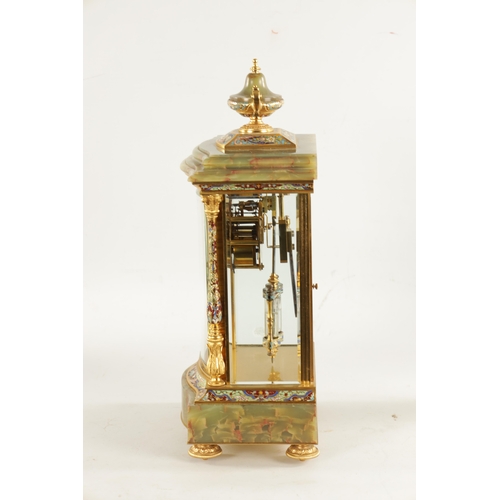 663 - A LATE 19TH CENTURY FRENCH ORMOLU, CHAMPLEVE ENAMEL AND ONYX MANTEL CLOCK surmounted by an urn finia... 