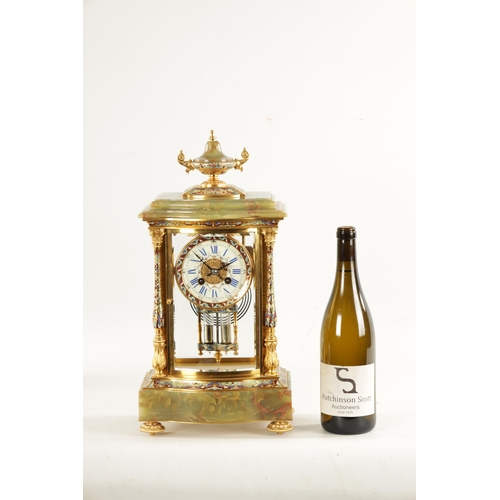 663 - A LATE 19TH CENTURY FRENCH ORMOLU, CHAMPLEVE ENAMEL AND ONYX MANTEL CLOCK surmounted by an urn finia... 