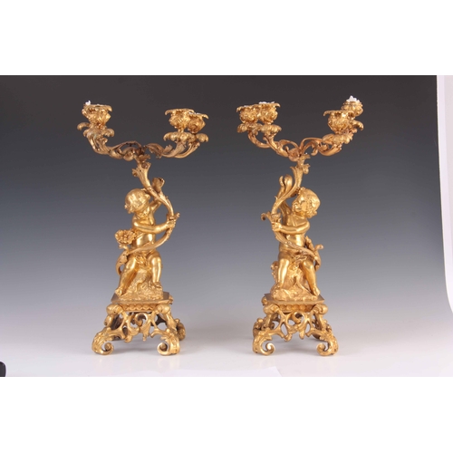 466 - A PAIR OF 19TH CENTURY GILT ORMOLU BRONZE FOUR BRANCH CANDELABRA with leaf and branchwork tops suppo... 