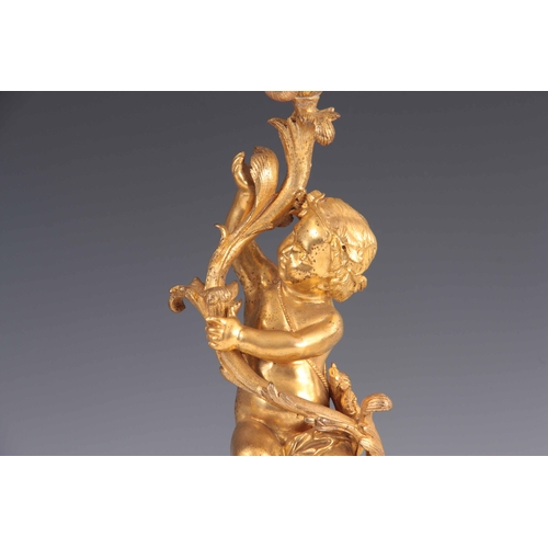 466 - A PAIR OF 19TH CENTURY GILT ORMOLU BRONZE FOUR BRANCH CANDELABRA with leaf and branchwork tops suppo... 