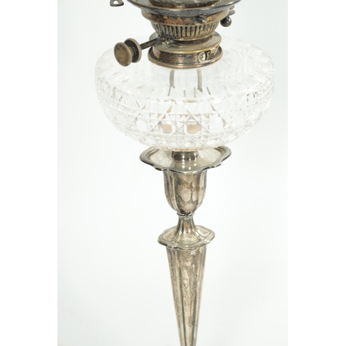 283 - AN EDWARDIAN SILVER OIL LAMP With fluted tapering stem and shaped base - Hawksworth, Eyre & Co Ltd. ... 