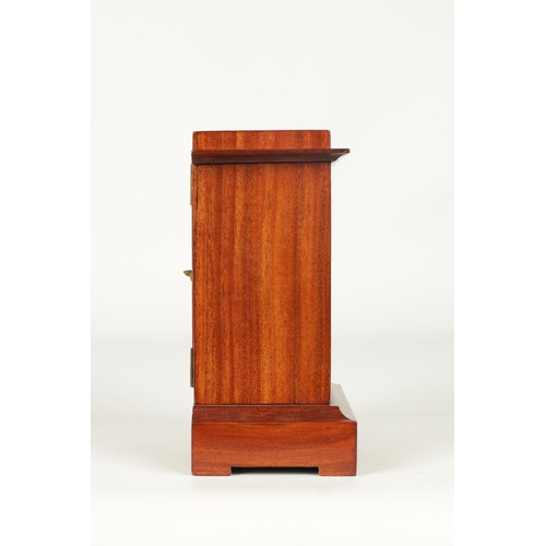 27 - A SMALL LATE 19TH CENTURY MAHOGANY MANTEL CLOCK Of rectangular form with glazed front enclosing a gi... 