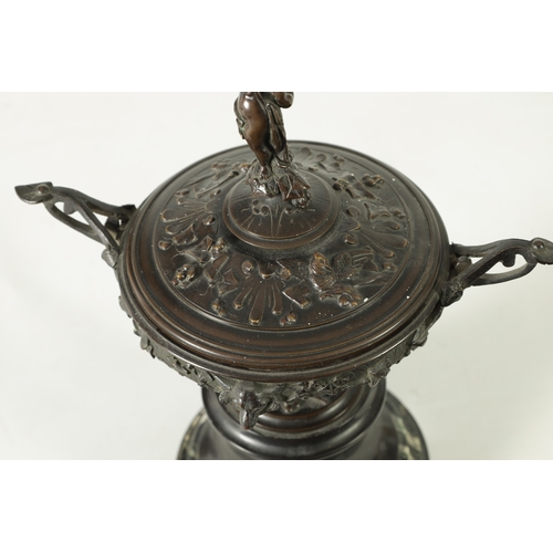 90 - A 19TH CENTURY BRONZE LIDDED TAZZA with figural finial and stylised floral decoration, raised on a g... 