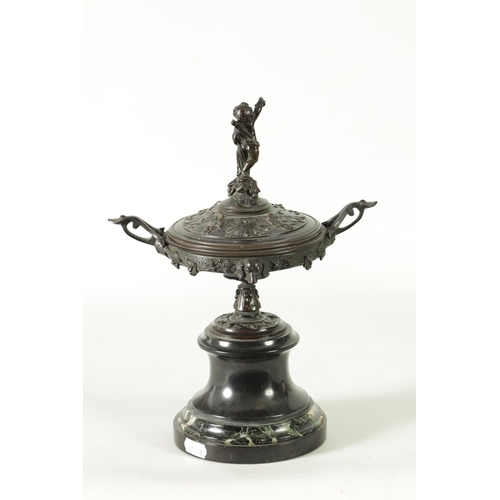 90 - A 19TH CENTURY BRONZE LIDDED TAZZA with figural finial and stylised floral decoration, raised on a g... 