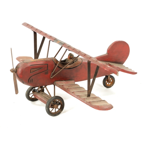 1 - A VINTAGE MODEL AEROPLANE with red paint and rubber wheels (75cm across 70cm overall)