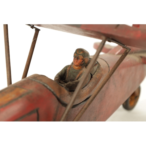 1 - A VINTAGE MODEL AEROPLANE with red paint and rubber wheels (75cm across 70cm overall)