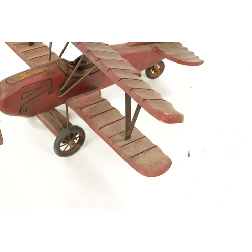 1 - A VINTAGE MODEL AEROPLANE with red paint and rubber wheels (75cm across 70cm overall)