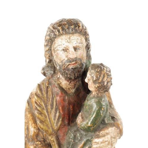 100 - AN EARLY 18TH CENTURY SPANISH CARVED FIGURE OF MOSES WITH CHILD having polychrome decoration. (42cm ... 