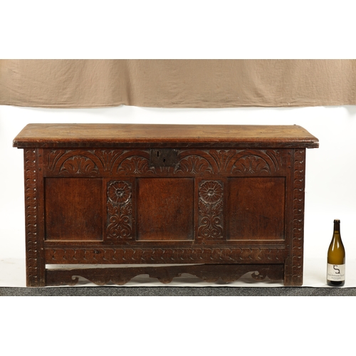 109 - A LATE 17TH CENTURY CARVED OAK THREE PANELLED COFFER with moulded edge top and arcaded front (132cm ... 