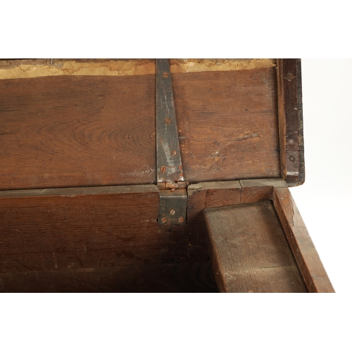 109 - A LATE 17TH CENTURY CARVED OAK THREE PANELLED COFFER with moulded edge top and arcaded front (132cm ... 