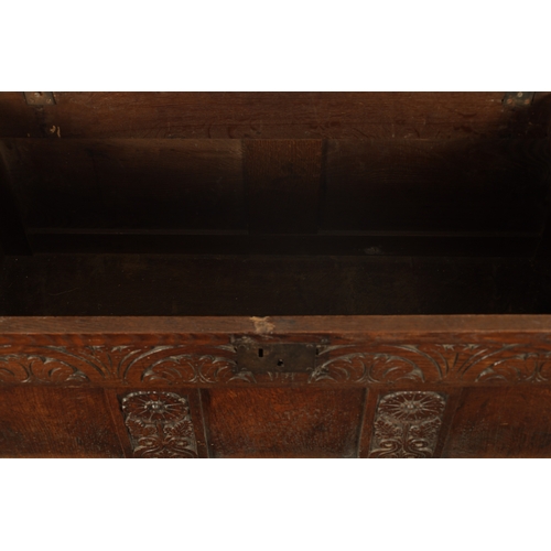 109 - A LATE 17TH CENTURY CARVED OAK THREE PANELLED COFFER with moulded edge top and arcaded front (132cm ... 