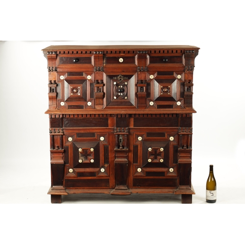 110 - A 17TH CENTURY TWO PART MOULDED FRONT YEW-WOOD, WALNUT AND EBONY CHEST OF DRAWERS with turned moulde... 