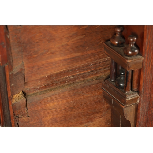 110 - A 17TH CENTURY TWO PART MOULDED FRONT YEW-WOOD, WALNUT AND EBONY CHEST OF DRAWERS with turned moulde... 