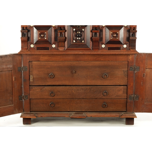 110 - A 17TH CENTURY TWO PART MOULDED FRONT YEW-WOOD, WALNUT AND EBONY CHEST OF DRAWERS with turned moulde... 