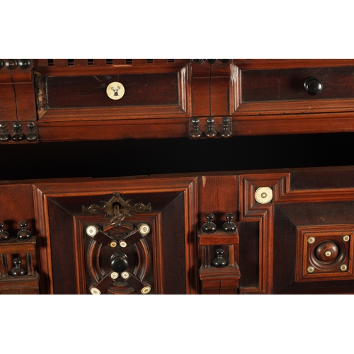 110 - A 17TH CENTURY TWO PART MOULDED FRONT YEW-WOOD, WALNUT AND EBONY CHEST OF DRAWERS with turned moulde... 