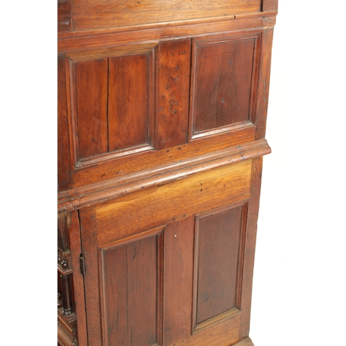 110 - A 17TH CENTURY TWO PART MOULDED FRONT YEW-WOOD, WALNUT AND EBONY CHEST OF DRAWERS with turned moulde... 