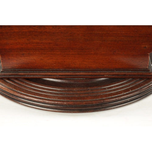 113 - A RARE 18TH CENTURY MAHOGANY REVOLVING CHEESE COASTER of sleigh form with ring turned base. (40cm wi... 