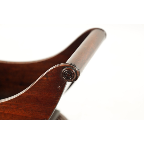 113 - A RARE 18TH CENTURY MAHOGANY REVOLVING CHEESE COASTER of sleigh form with ring turned base. (40cm wi... 