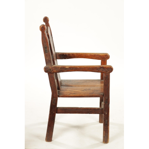 116 - AN UNUSUAL 18TH CENTURY WELSH SCUMBLED PINE CHILD’S CHAIR with wavey edge back (31cm wide 61cm high)