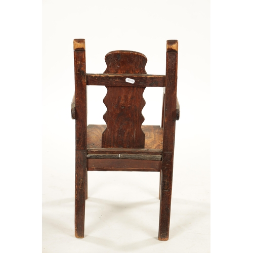 116 - AN UNUSUAL 18TH CENTURY WELSH SCUMBLED PINE CHILD’S CHAIR with wavey edge back (31cm wide 61cm high)