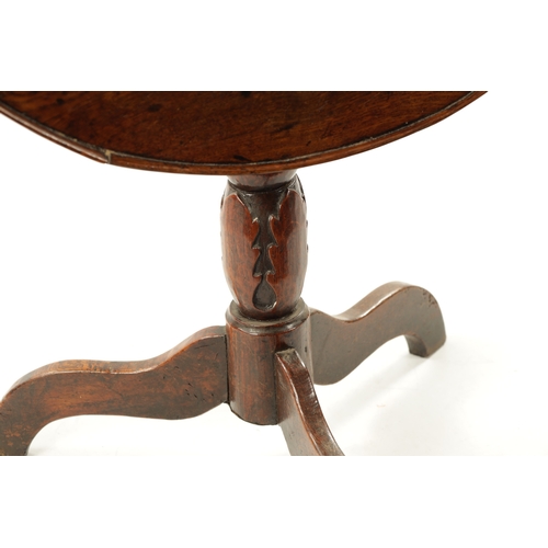 123 - AN 18TH CENTURY WELSH OAK TRIPOD TABLE with gallery top and carved stem (73cm diameter 74cm high)