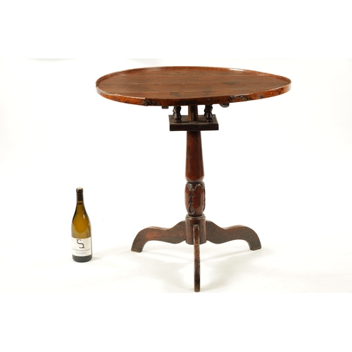 123 - AN 18TH CENTURY WELSH OAK TRIPOD TABLE with gallery top and carved stem (73cm diameter 74cm high)