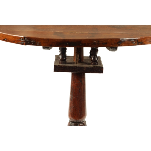 123 - AN 18TH CENTURY WELSH OAK TRIPOD TABLE with gallery top and carved stem (73cm diameter 74cm high)