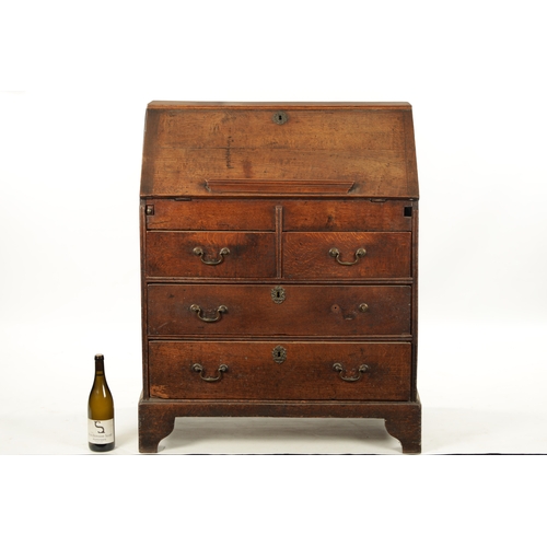 124 - AN EARLY 18TH CENTURY FIGURED OAK COUNTRY MADE BUREAU with fitted hinged fall above a bank of two sm... 