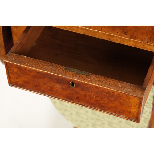 126 - A REGENCY BURR ELM WORK BOX with drop down leaves, fitted drawer and silhouette shaped platform base... 