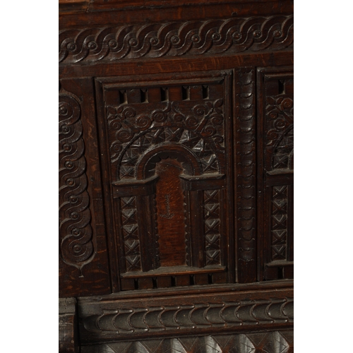 132 - AN EARLY 18TH CENTURY FLEMISH OAK KIST DATED 1718 having superb colour and patina with carved arcade... 