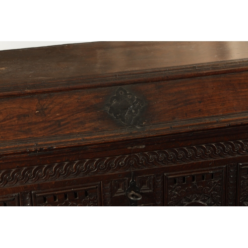 132 - AN EARLY 18TH CENTURY FLEMISH OAK KIST DATED 1718 having superb colour and patina with carved arcade... 