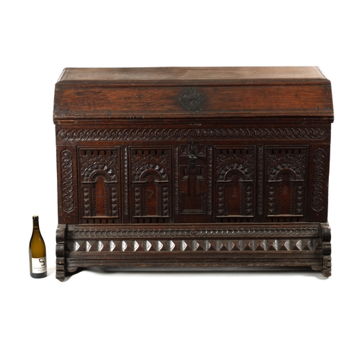 132 - AN EARLY 18TH CENTURY FLEMISH OAK KIST DATED 1718 having superb colour and patina with carved arcade... 