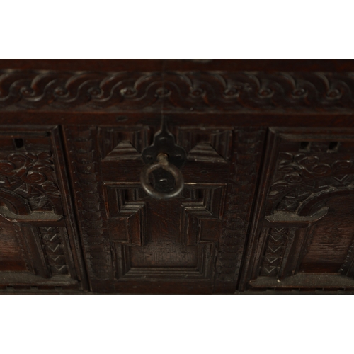 132 - AN EARLY 18TH CENTURY FLEMISH OAK KIST DATED 1718 having superb colour and patina with carved arcade... 