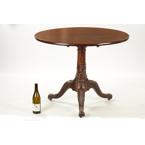 136 - AN UNUSUAL 18TH CENTURY IRISH LARGE MAHOGANY TRIPOD TABLE WITH CARVED LEGS AND SCROLL FEET (93cm dia... 