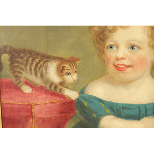 138 - A 19TH CENTURY OIL ON CANVAS depicting a young girl playing with a cat - mounted in cushioned bird's... 