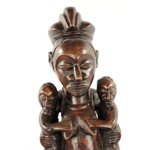 148 - AN ANTIQUE CARVED HARDWOOD YAKA MATERNITY CONGO FIGURE (59cm high)