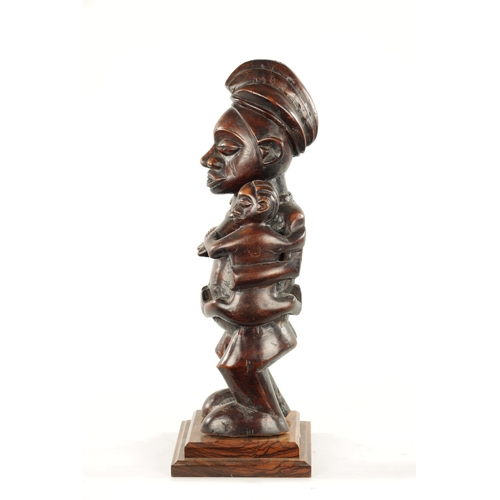 148 - AN ANTIQUE CARVED HARDWOOD YAKA MATERNITY CONGO FIGURE (59cm high)