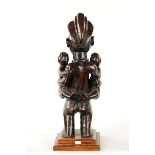 148 - AN ANTIQUE CARVED HARDWOOD YAKA MATERNITY CONGO FIGURE (59cm high)