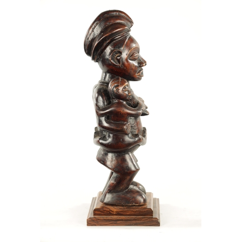 148 - AN ANTIQUE CARVED HARDWOOD YAKA MATERNITY CONGO FIGURE (59cm high)