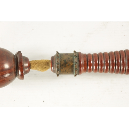 152 - A RARE 19TH CENTURY TREEN KOSH with ribbed handle and brass collar (25cm overall)