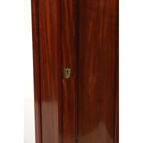 153 - A 19TH CENTURY MAHOGANY SERPENTINE FRONTED HANGING CORNER CUPBOARD IN THE MANNER OF DUNCAN PHYFE wit... 