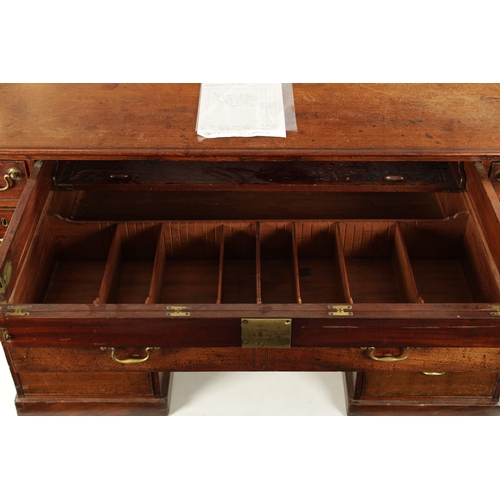 162 - A GEORGE III MAHOGANY LIBRARY DESK with fall forward top secretaire drawer having adjustable writing... 