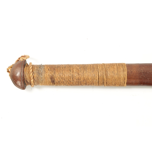 166 - AN ANTIQUE HARDWOOD FIGEAN CLUB with spring handle, bearing old infantry number (69cm overall)