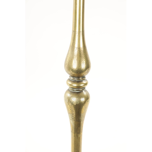 167 - A 19TH CENTURY EASTERN BRASS CANDLESTICK with circular engraved base. (52cm high)