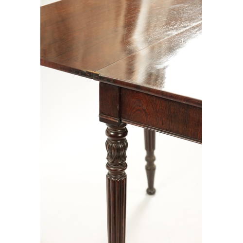 175 - A REGENCY ROSEWOOD TEA TABLE IN THE MANNER OF GILLOWS with crossbanded top; raised on tapering leaf ... 